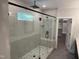 Luxurious bathroom featuring a glass-enclosed shower with bench seating and a tiled niche at 122 Sanderway Dr, Chapel Hill, NC 27516