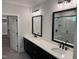 Bathroom boasting double vanities, sleek black fixtures and hardware, and a glass-enclosed shower at 122 Sanderway Dr, Chapel Hill, NC 27516