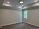 Carpeted bedroom featuring recessed lighting and a window offering private backyard views at 122 Sanderway Dr, Chapel Hill, NC 27516