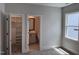 Neutral bedroom featuring plush carpet, and offering access to a walk-in closet and en-suite bathroom with natural light from a window at 122 Sanderway Dr, Chapel Hill, NC 27516