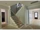 Interior view of the entryway with stairs and molding at 122 Sanderway Dr, Chapel Hill, NC 27516