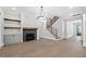 Cozy living room with a fireplace, hardwood floors, and plenty of natural light at 122 Sanderway Dr, Chapel Hill, NC 27516