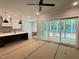 Living room with kitchen, island, and screened in porch with trees at 122 Sanderway Dr, Chapel Hill, NC 27516