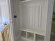 Mudroom view featuring a built-in storage cubby and an unfinished staircase at 122 Sanderway Dr, Chapel Hill, NC 27516