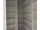 Bright white pantry with multiple shelves for optimal storage and organization at 122 Sanderway Dr, Chapel Hill, NC 27516