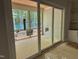 Covered back patio offers a serene view of the treed backyard and is accessible through large sliding glass doors at 122 Sanderway Dr, Chapel Hill, NC 27516