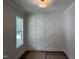 Stylish room featuring a unique accent wall, crown molding, and a window at 122 Sanderway Dr, Chapel Hill, NC 27516