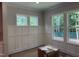 Bright room featuring wainscoting detail and multiple windows offering plenty of natural light at 122 Sanderway Dr, Chapel Hill, NC 27516