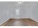 Bright bedroom featuring wood-look flooring at 128 Warren Ave, Oxford, NC 27565