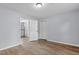 Bedroom featuring wood-look flooring and a view into the kitchen at 128 Warren Ave, Oxford, NC 27565