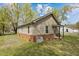 Charming home featuring vinyl siding, brick foundation, and a covered porch at 128 Warren Ave, Oxford, NC 27565