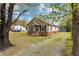 Charming single-story home featuring a cozy front porch and well-maintained yard, perfect for relaxed outdoor living at 128 Warren Ave, Oxford, NC 27565