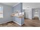 Kitchen featuring a breakfast bar and refrigerator at 128 Warren Ave, Oxford, NC 27565