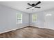 Bright living room featuring windows and wood-look flooring at 128 Warren Ave, Oxford, NC 27565