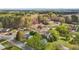 Aerial view of the neighborhood with mature trees and surrounding homes at 128 Warren Ave, Oxford, NC 27565