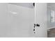 Step into the bright and clean shower, offering a refreshing escape and a sleek design for your daily routine at 128 Warren Ave, Oxford, NC 27565