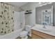 Updated bathroom with a shower and tub combo, toilet, and vanity with storage space, creating a functional space at 131 Dove Cottage Ln, Cary, NC 27519