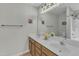 This bathroom features double sinks and is well-lit with a neutral aesthetic for your enjoyment at 131 Dove Cottage Ln, Cary, NC 27519
