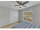 This bedroom features a ceiling fan and a double door closet providing ample storage and space at 131 Dove Cottage Ln, Cary, NC 27519