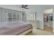 Bright bedroom with a large window and a spacious closet for easy storage and organization at 131 Dove Cottage Ln, Cary, NC 27519