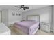 This bedroom features neutral walls and a ceiling fan for a serene and comfortable living space at 131 Dove Cottage Ln, Cary, NC 27519