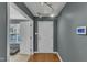 Entryway features gray walls, hardwood floors, track lighting, and a visible security system at 131 Dove Cottage Ln, Cary, NC 27519