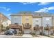 These townhomes have rear garages, decks and are painted in complimentary colors with blue skies in the background at 131 Dove Cottage Ln, Cary, NC 27519