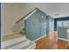 Hallway and stairway with decorative wall art, hardwood floors, and carpeted stairs at 131 Dove Cottage Ln, Cary, NC 27519