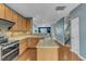 Updated kitchen with ample cabinetry, modern appliances, and an island for added counter space at 131 Dove Cottage Ln, Cary, NC 27519
