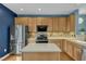 Modern kitchen featuring stainless steel appliances, stylish countertops, and ample cabinet space at 131 Dove Cottage Ln, Cary, NC 27519