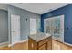 This kitchen features a center island, double doors leading to the outside, and hardwood floors at 131 Dove Cottage Ln, Cary, NC 27519