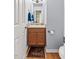 Compact powder room featuring a single vanity and wood floors at 131 Hay Field Drive Dr, Clayton, NC 27520