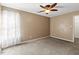 Unfurnished bedroom with carpet, neutral walls, and bright lighting at 131 Hay Field Drive Dr, Clayton, NC 27520