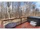 Deck area featuring a hot tub and scenic natural surroundings at 131 Hay Field Drive Dr, Clayton, NC 27520