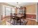 Dining area with a bay window, chandelier, and hardwood floors at 131 Hay Field Drive Dr, Clayton, NC 27520