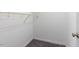 Empty walk-in closet with basic wire shelving and neutral carpet at 131 Hay Field Drive Dr, Clayton, NC 27520
