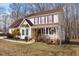 Attractive home featuring a cozy front porch, bay window, and well-manicured landscaping at 131 Hay Field Drive Dr, Clayton, NC 27520