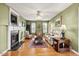 View of a welcoming living room with light green walls and a fireplace at 131 Hay Field Drive Dr, Clayton, NC 27520