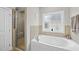 Relax in this tub next to a window and separated shower at 1320 Blue Heron Dr, Nashville, NC 27856