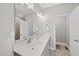 Bathroom features a double sink vanity with gray cabinets at 1320 Blue Heron Dr, Nashville, NC 27856
