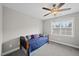 Cozy bedroom features a ceiling fan and a window at 1320 Blue Heron Dr, Nashville, NC 27856