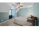 Bedroom featuring a neutral bedspread, ceiling fan, and gray carpet offers a blend of comfort and style at 1320 Blue Heron Dr, Nashville, NC 27856