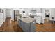 Well-appointed kitchen featuring granite countertops, stainless steel appliances, white cabinetry, and a gray island at 1320 Blue Heron Dr, Nashville, NC 27856