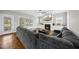Relaxing living room features a fireplace, large windows and hardwood floors at 1320 Blue Heron Dr, Nashville, NC 27856