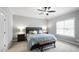 Clean main bedroom with neutral walls features a large bed, nightstands and bench at 1320 Blue Heron Dr, Nashville, NC 27856