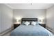 Clean main bedroom with neutral walls features a large bed and matching nightstands at 1320 Blue Heron Dr, Nashville, NC 27856