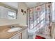 Bathroom featuring a shower and tub combination with vanity and mirror at 135 Stillmeadow Dr, Louisburg, NC 27549