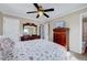 Bedroom featuring a ceiling fan and a dresser with a television at 135 Stillmeadow Dr, Louisburg, NC 27549