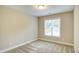 Empty bedroom with neutral carpet, one window and light walls at 1354 Red Bud Ct, Wake Forest, NC 27587