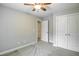 Bedroom with gray walls featuring a closet and doorway at 1354 Red Bud Ct, Wake Forest, NC 27587